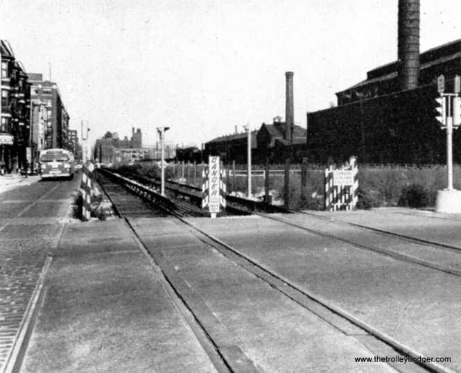 The temporary “L” service in Van Buren Street, which operated from September 1953 to June 1958, shown here at Loomis prior to the demolition of the cavernous Throop street shops at right.